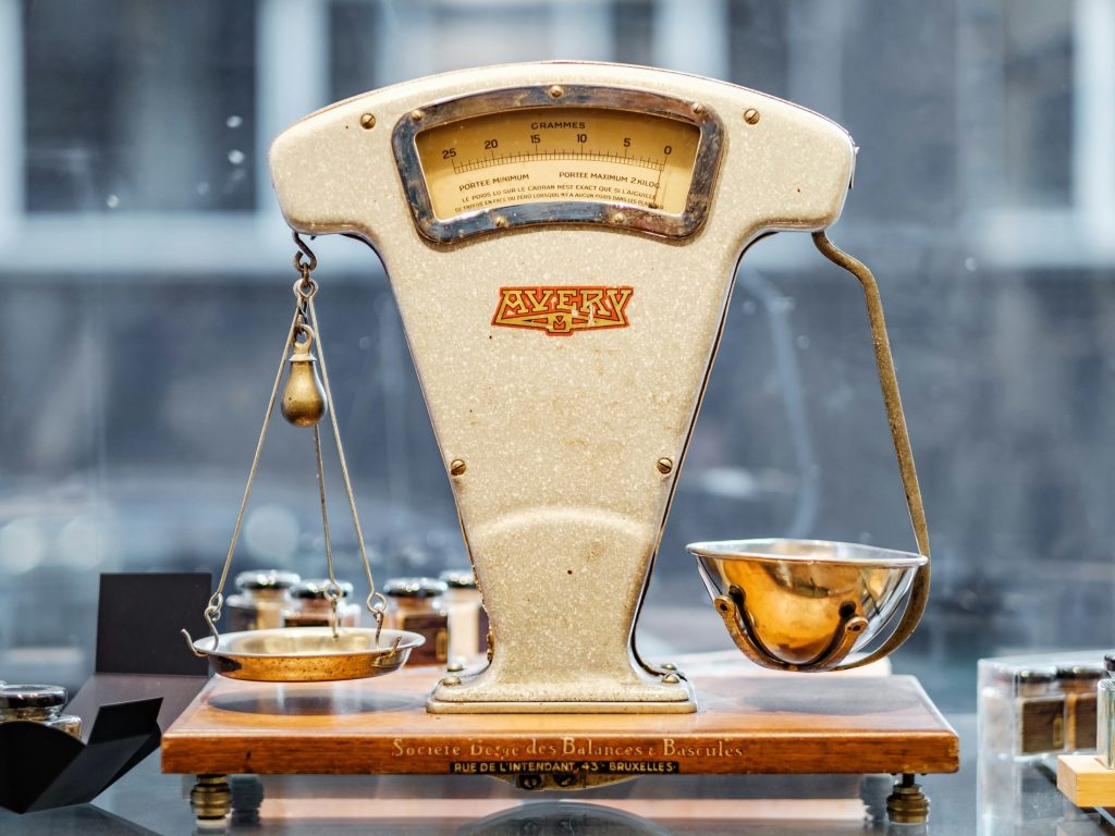 Weighing scales representing balance as AI cost efficiency and data sovereignty are at odds, forcing a rethink of enterprise risk frameworks for global organisations.