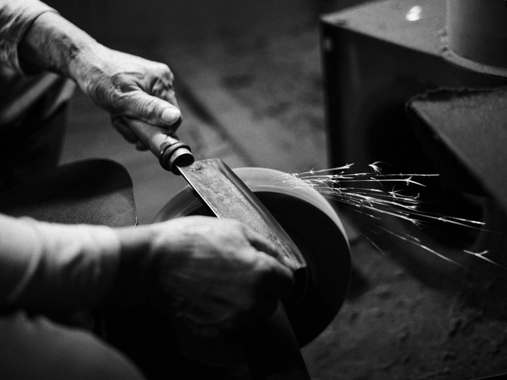 Person honing a tool as Deep Cogito releases Cogito v2, a new family of open-source AI models that sharpen their own reasoning skills.